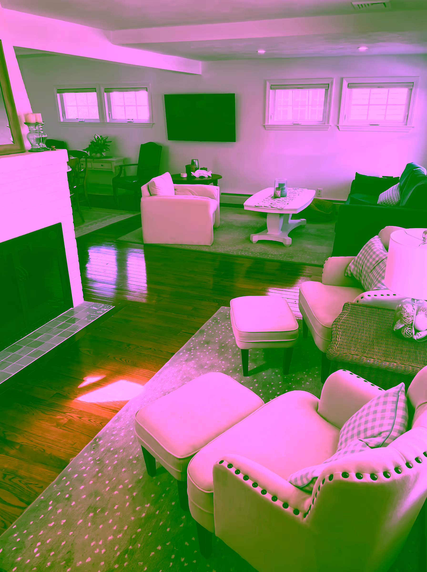 Cozy living room with a white brick gas fireplace, seen on a gray off-season afternoon
